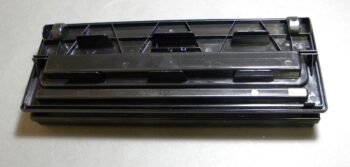 Black plastic rectangular printer cartridge part
